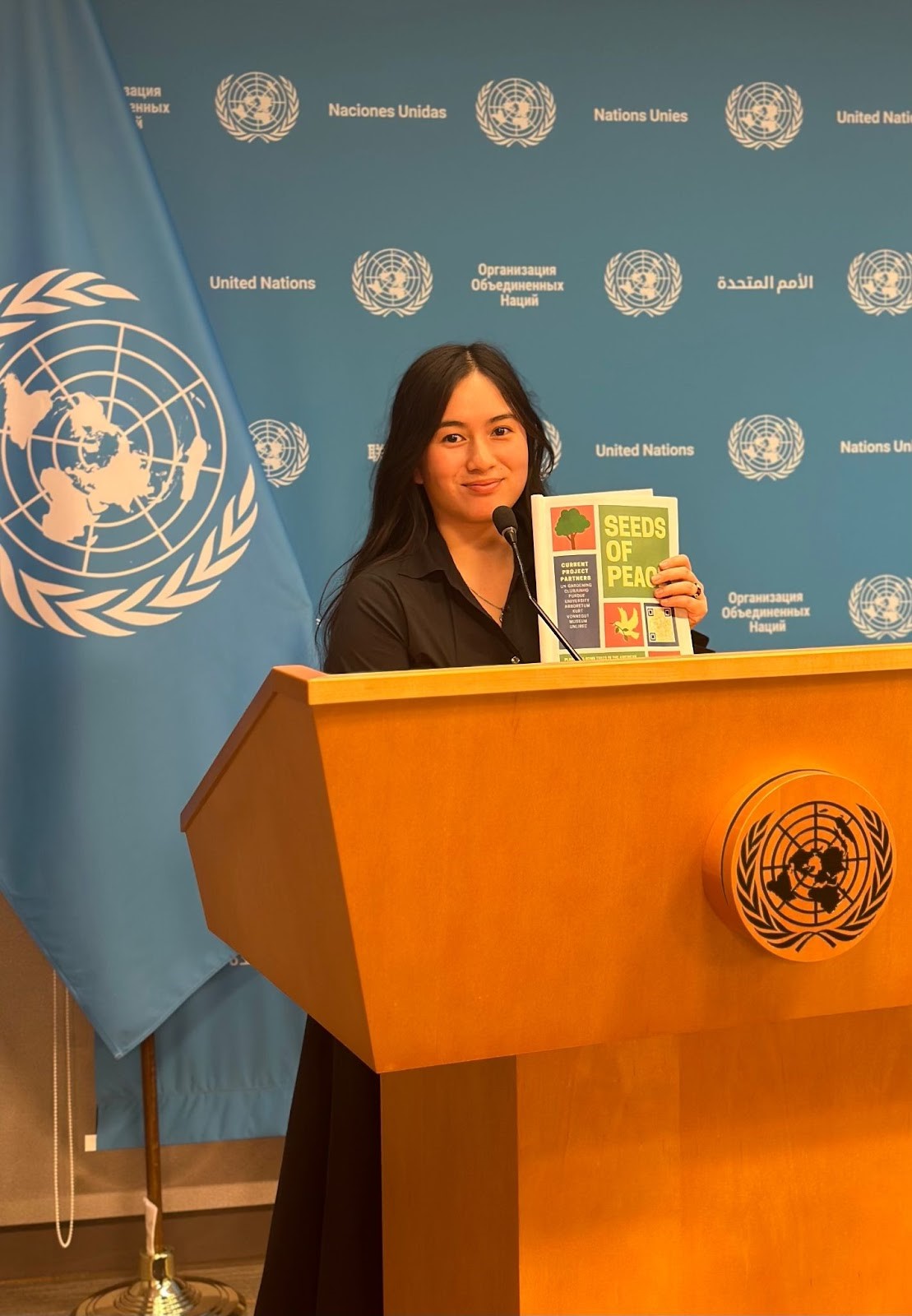 A person standing at a podium holding a book
AI-generated content may be incorrect., Picture