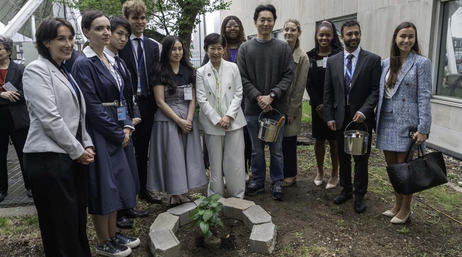 High Representative for Disarmament Affairs, Izumi Nakamitsu and Charlotte Yeung together with young people at the tree planting ceremony